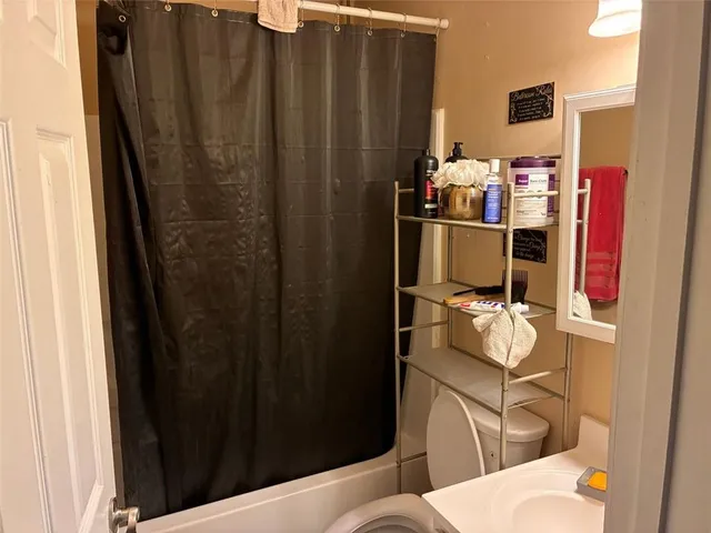 a bathroom with a sink and toilet