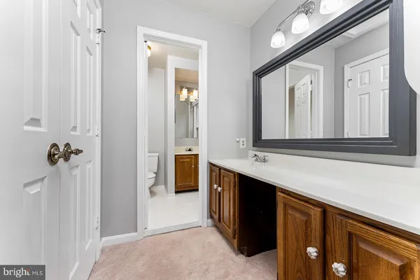 a bathroom with a double vanity sink and mirror