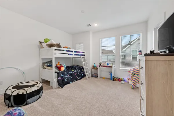 a bed room with a bed and a window