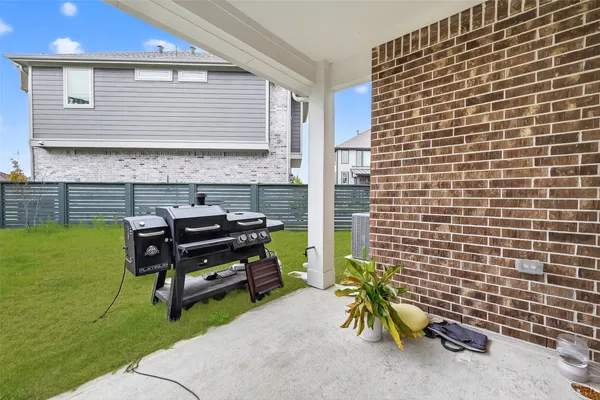 a yellow and sitting area in front of a house