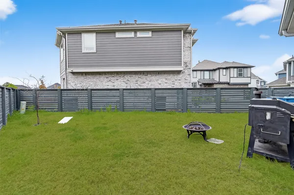 a view of a backyard with swimming pool