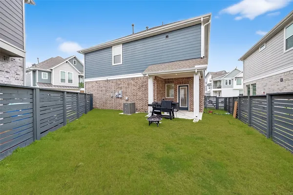 a view of backyard with a chair and a table