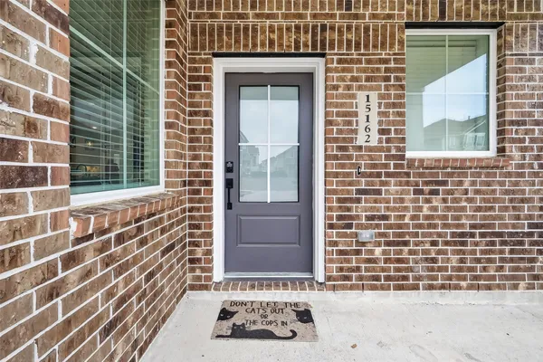 a view of a door and a window