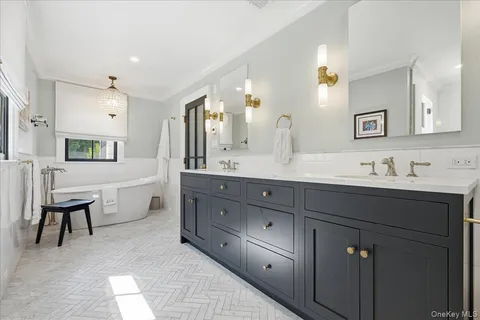 a spacious bathroom with a double vanity sink double and mirror
