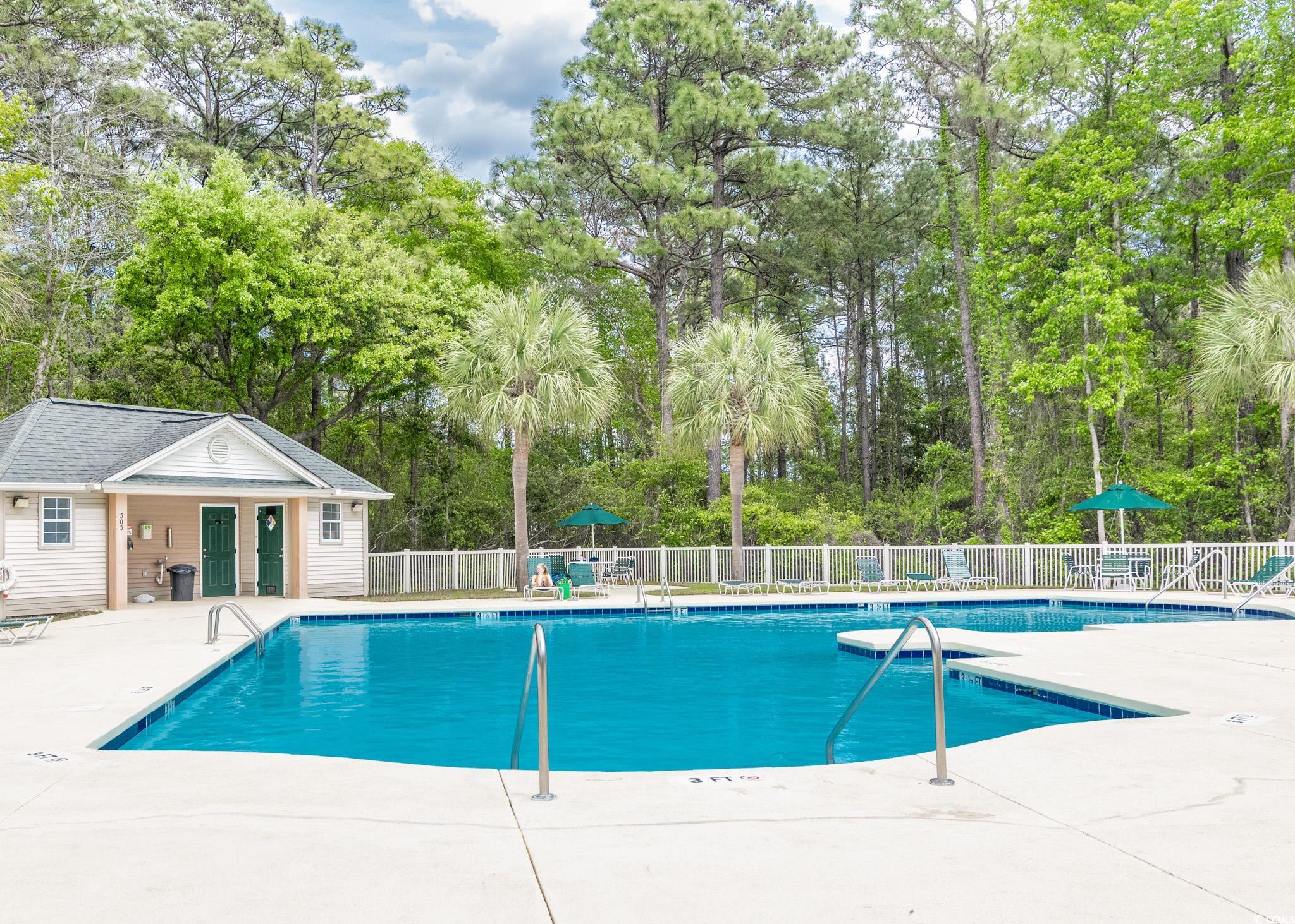227 Pinehurst Lane, Unit 6D Pawleys Island, SC 29585 - Photo 14 of 39 Pool with fence and a patio area