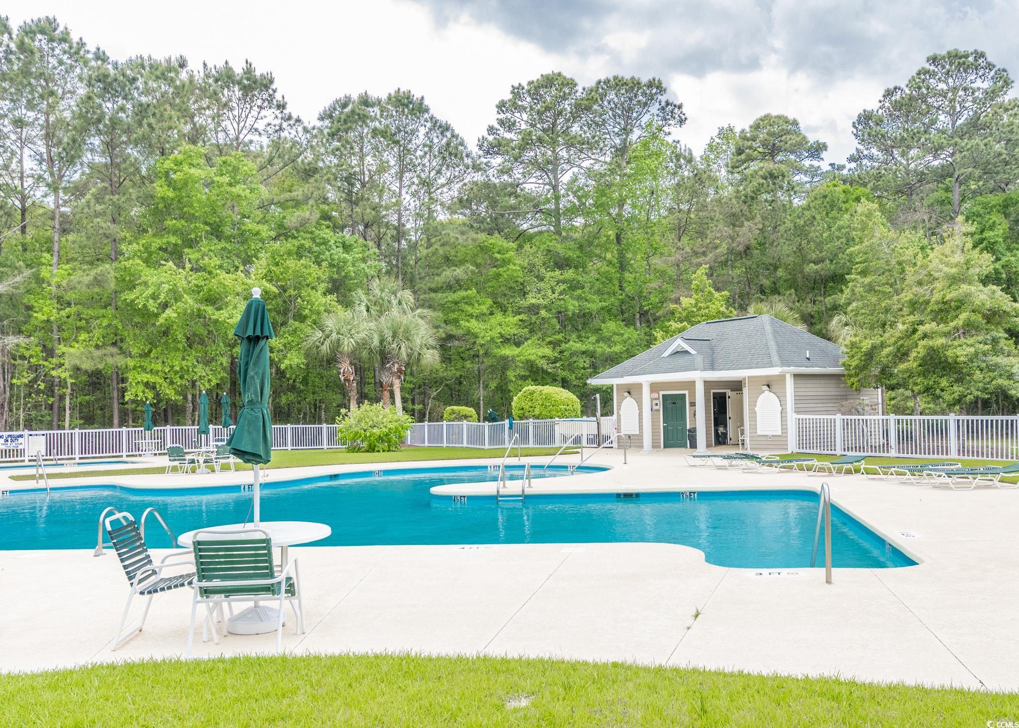 227 Pinehurst Lane, Unit 6D Pawleys Island, SC 29585 - Photo 15 of 39 Pool featuring fence and a patio area