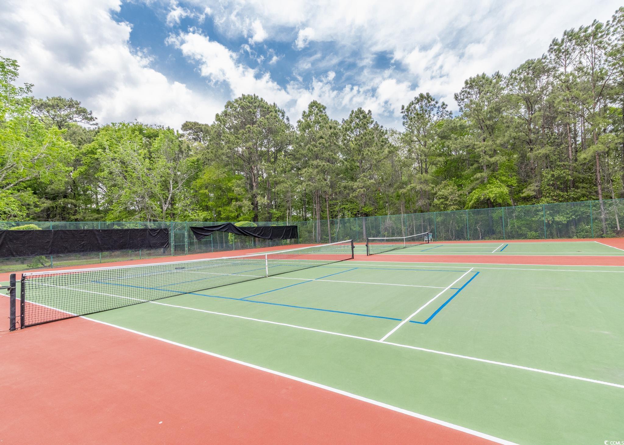 227 Pinehurst Lane, Unit 6D Pawleys Island, SC 29585 - Photo 16 of 39 View of sport court with fence and community basketball court