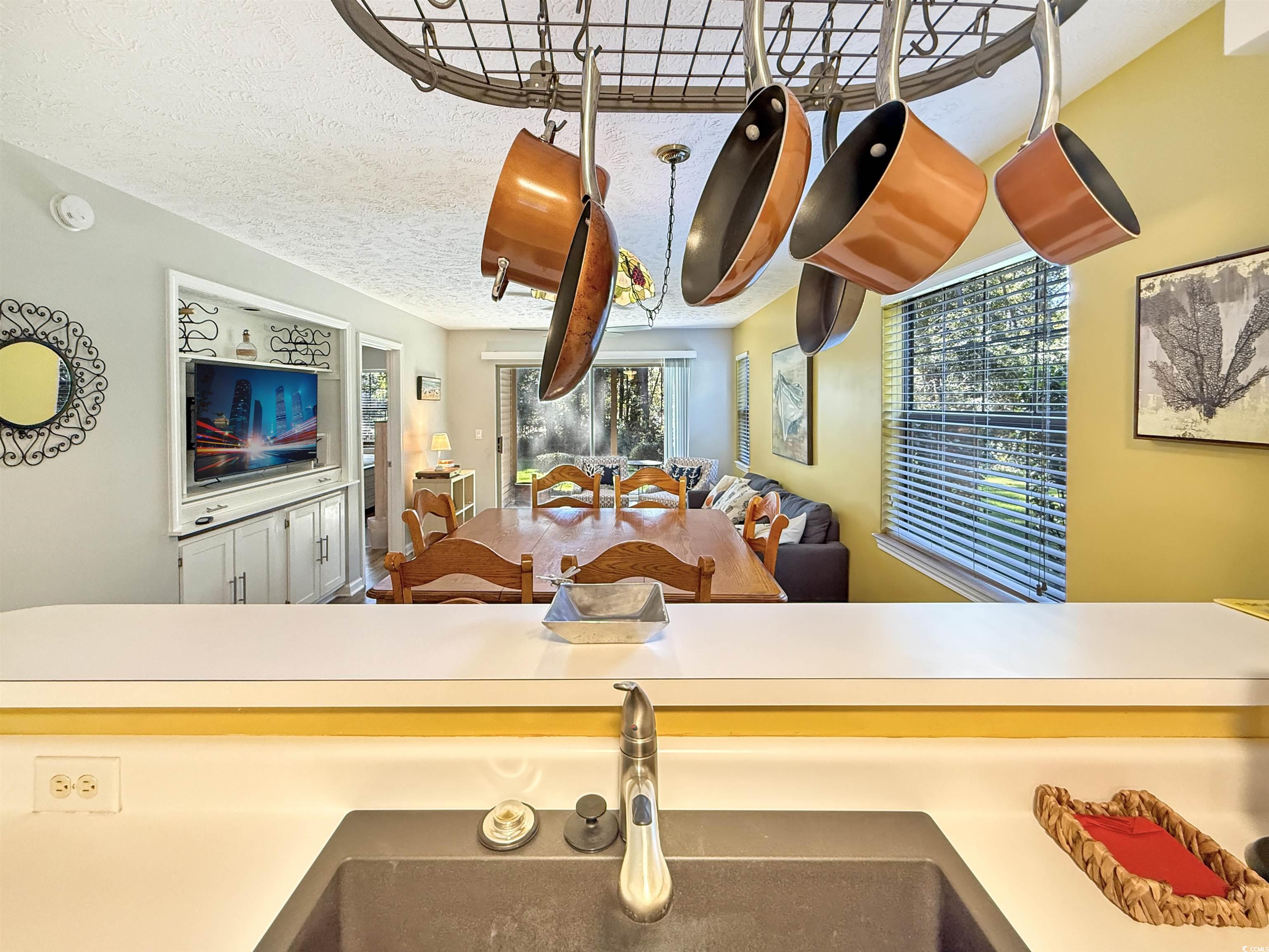 227 Pinehurst Lane, Unit 6D Pawleys Island, SC 29585 - Photo 29 of 39 Kitchen with a textured ceiling and light countertops