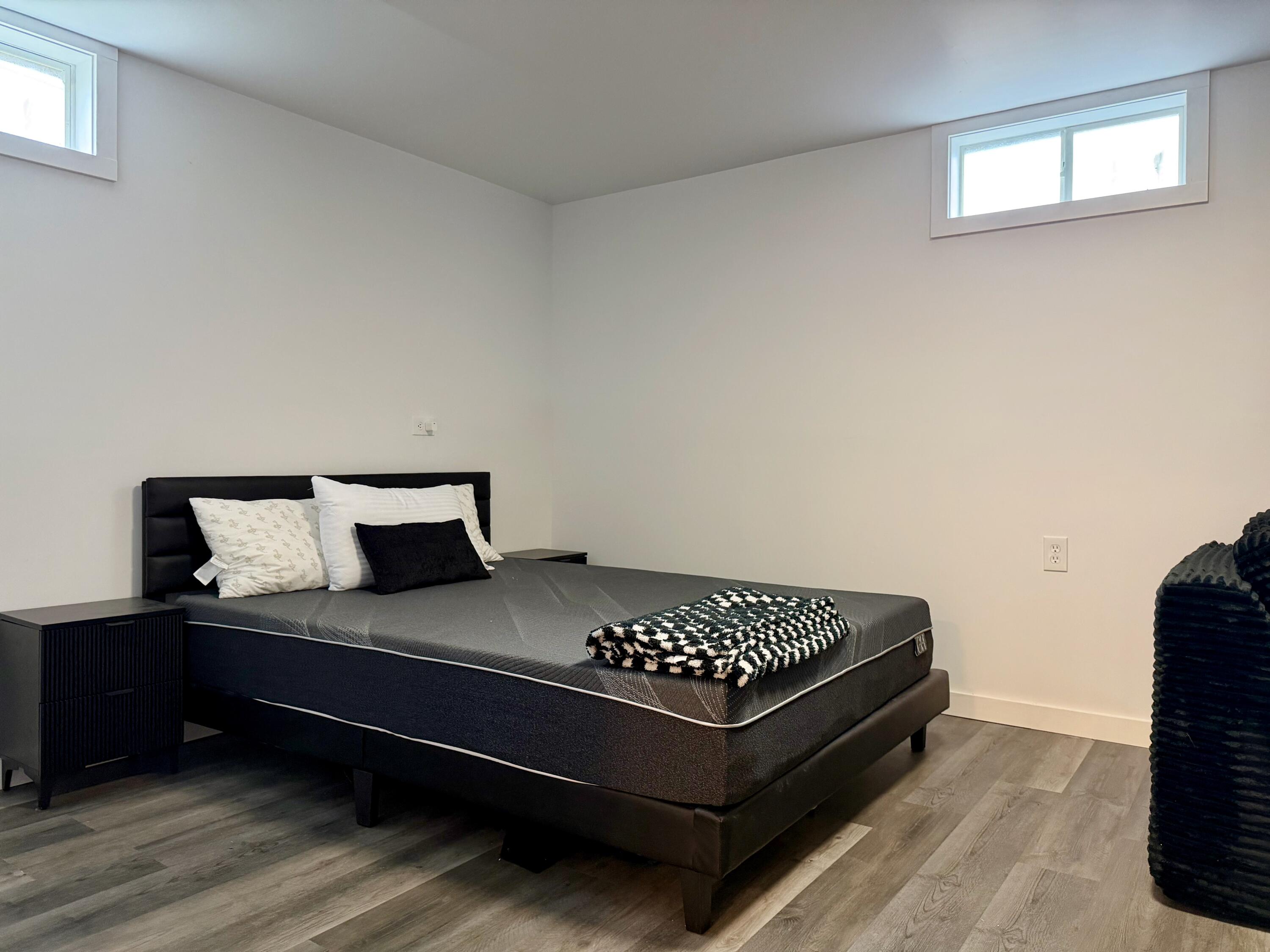 5850 West 600 North Winamac, IN 46996 - Photo 15 of 28 a bedroom with a bed and wooden floor