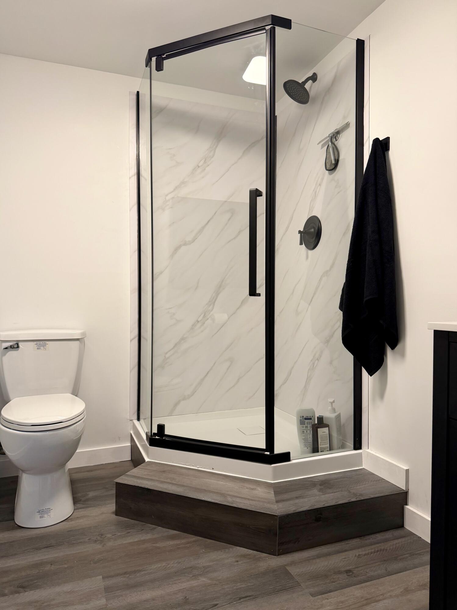 5850 West 600 North Winamac, IN 46996 - Photo 18 of 28 a bathroom with a toilet and a shower