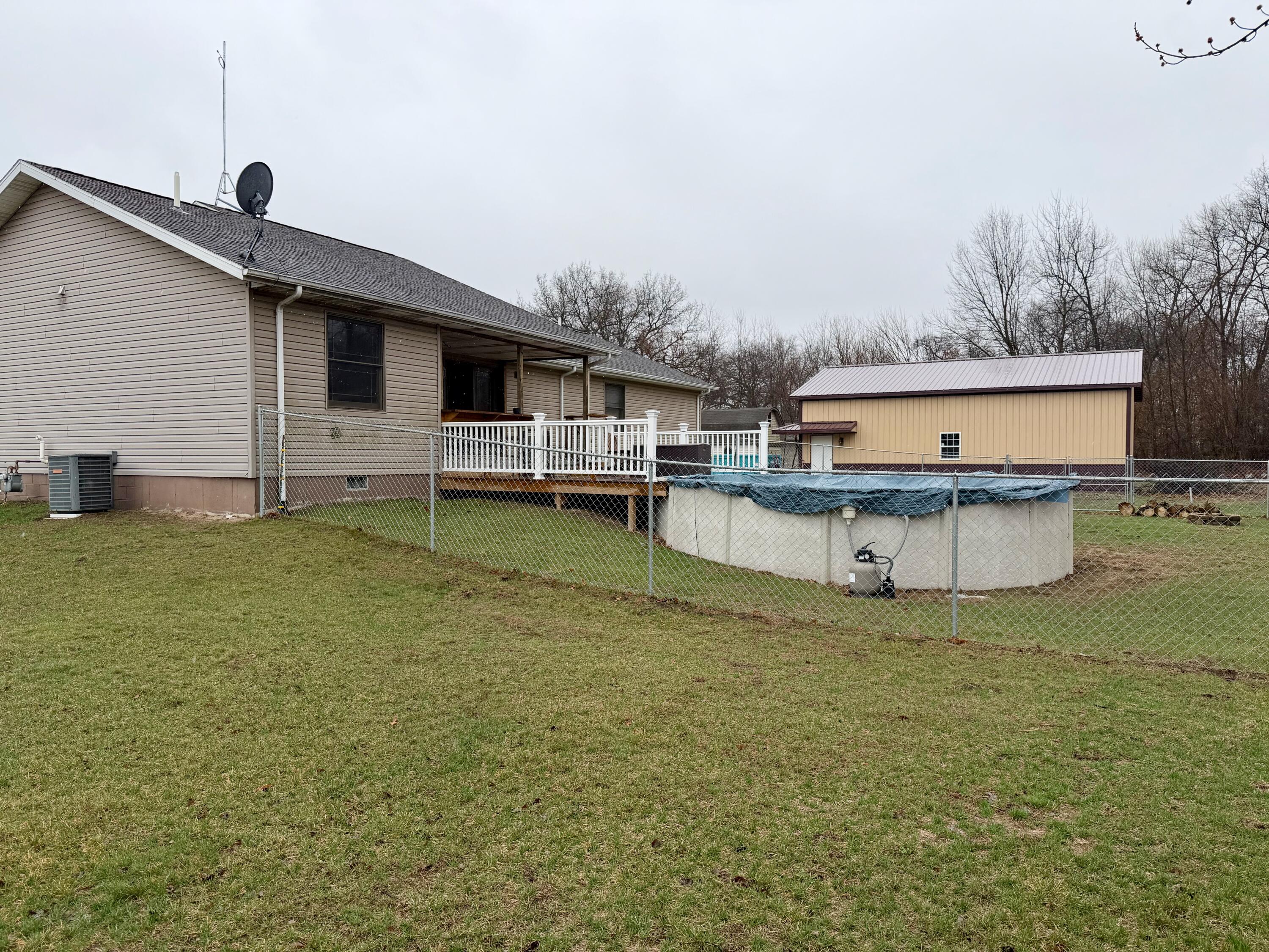 5850 West 600 North Winamac, IN 46996 - Photo 22 of 28 a view of a house with a backyard and a chair