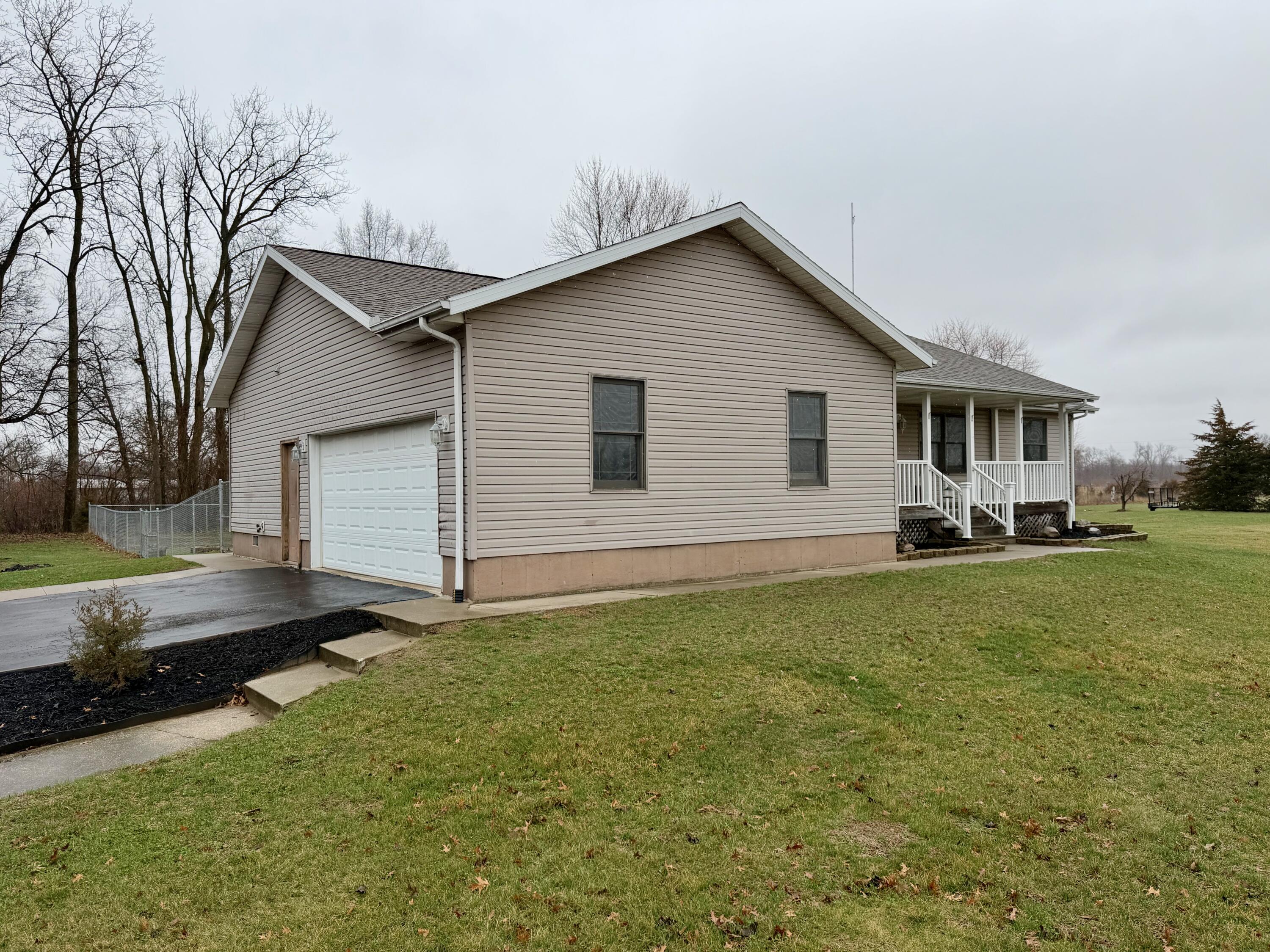 5850 West 600 North Winamac, IN 46996 - Photo 25 of 28 a front view of house with yard and green space