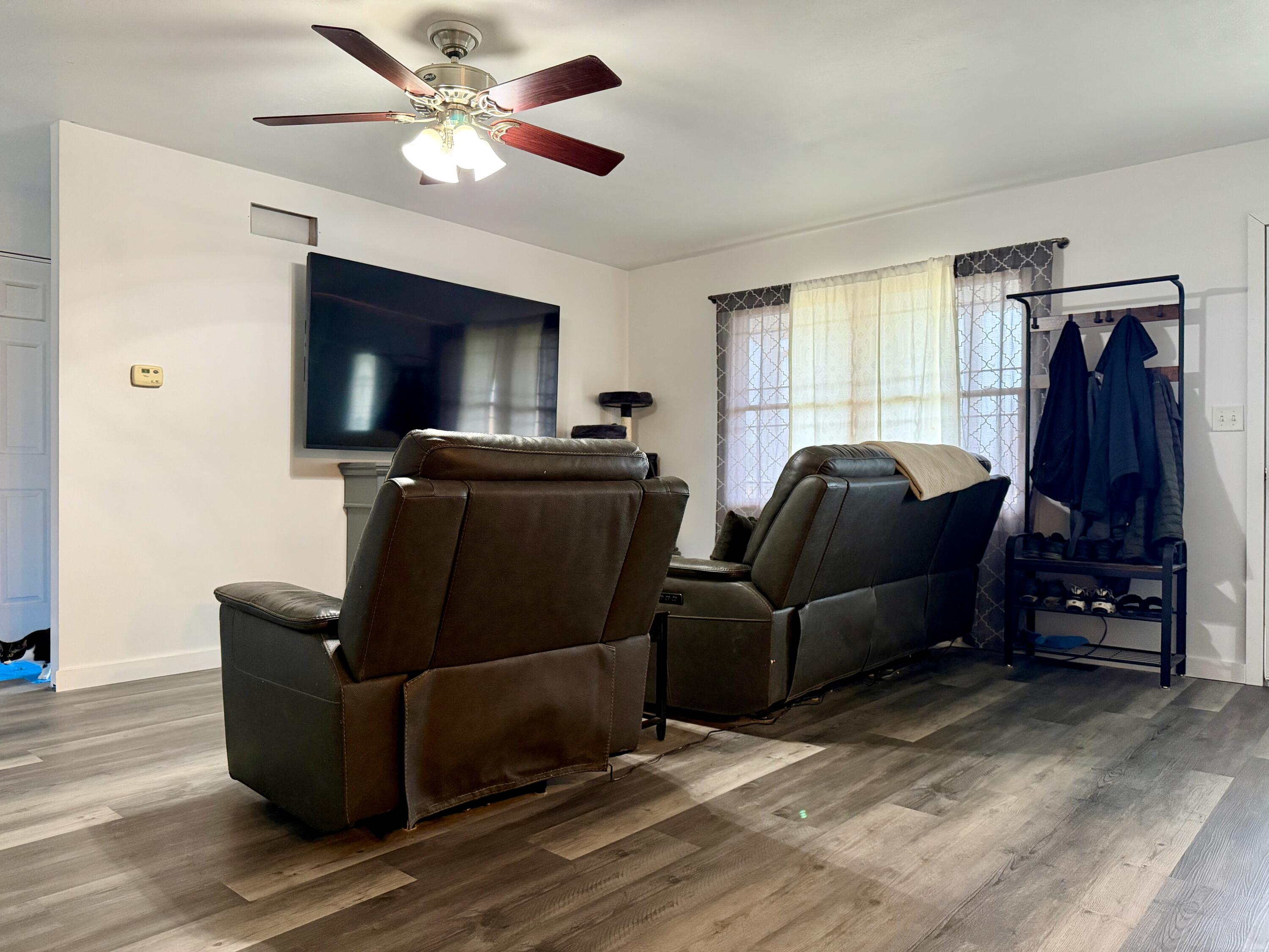 5850 West 600 North Winamac, IN 46996 - Photo 3 of 28 a living room with furniture and a flat screen tv