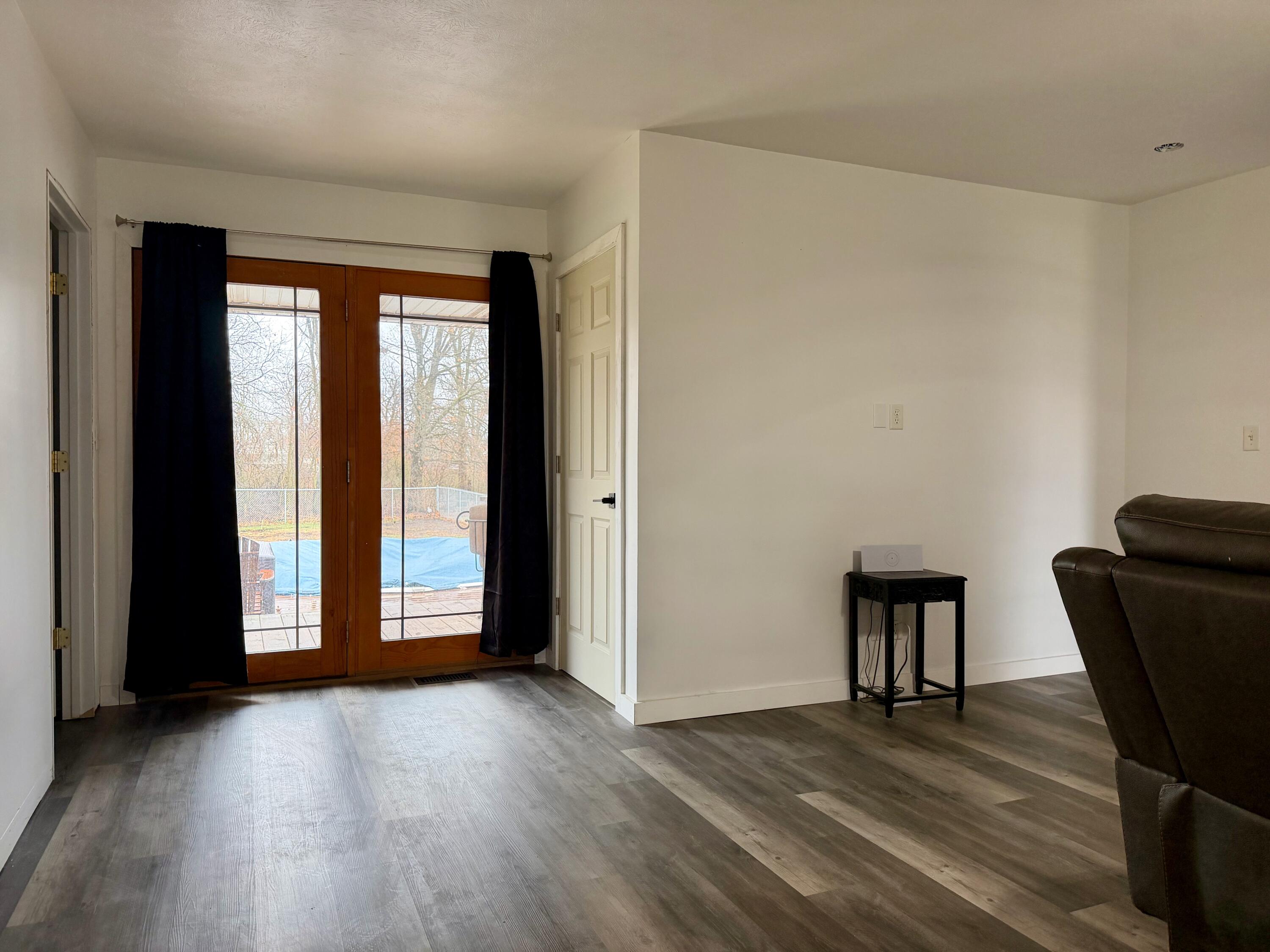 5850 West 600 North Winamac, IN 46996 - Photo 4 of 28 a view of a livingroom with wooden floor and furniture