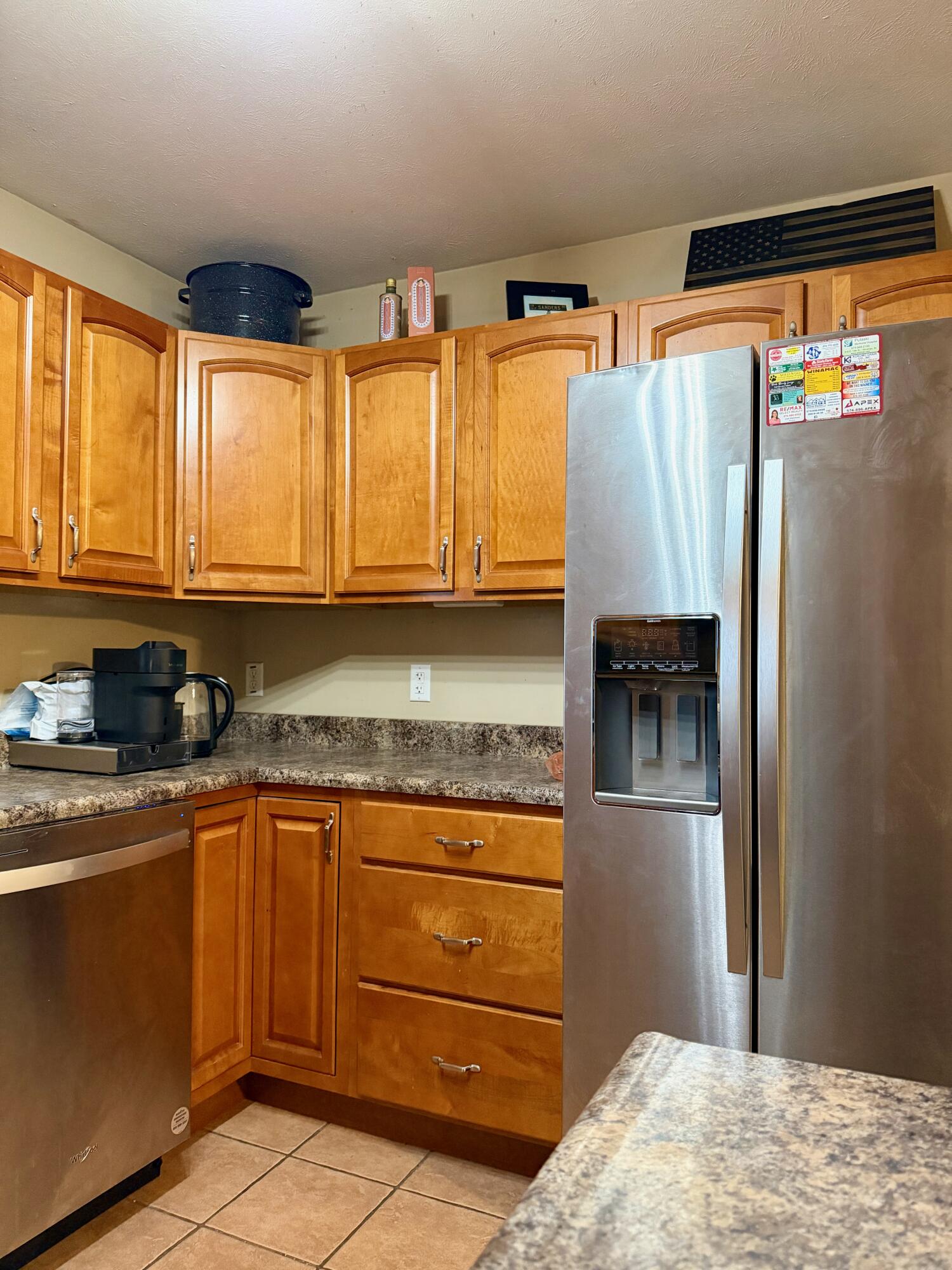 5850 West 600 North Winamac, IN 46996 - Photo 7 of 28 a kitchen with stainless steel appliances granite countertop a refrigerator and a stove top oven