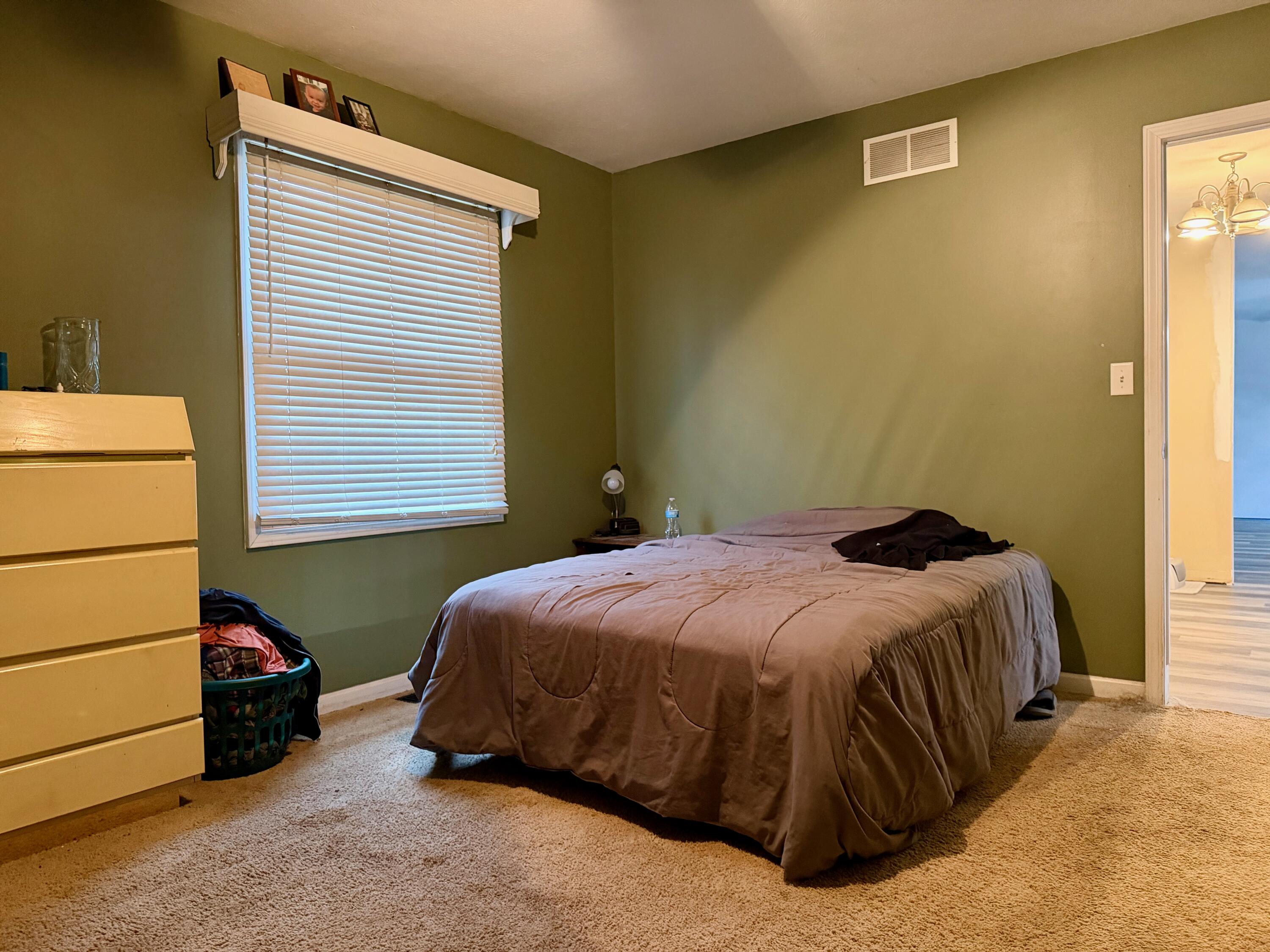 5850 West 600 North Winamac, IN 46996 - Photo 8 of 28 a bedroom with a bed and a window