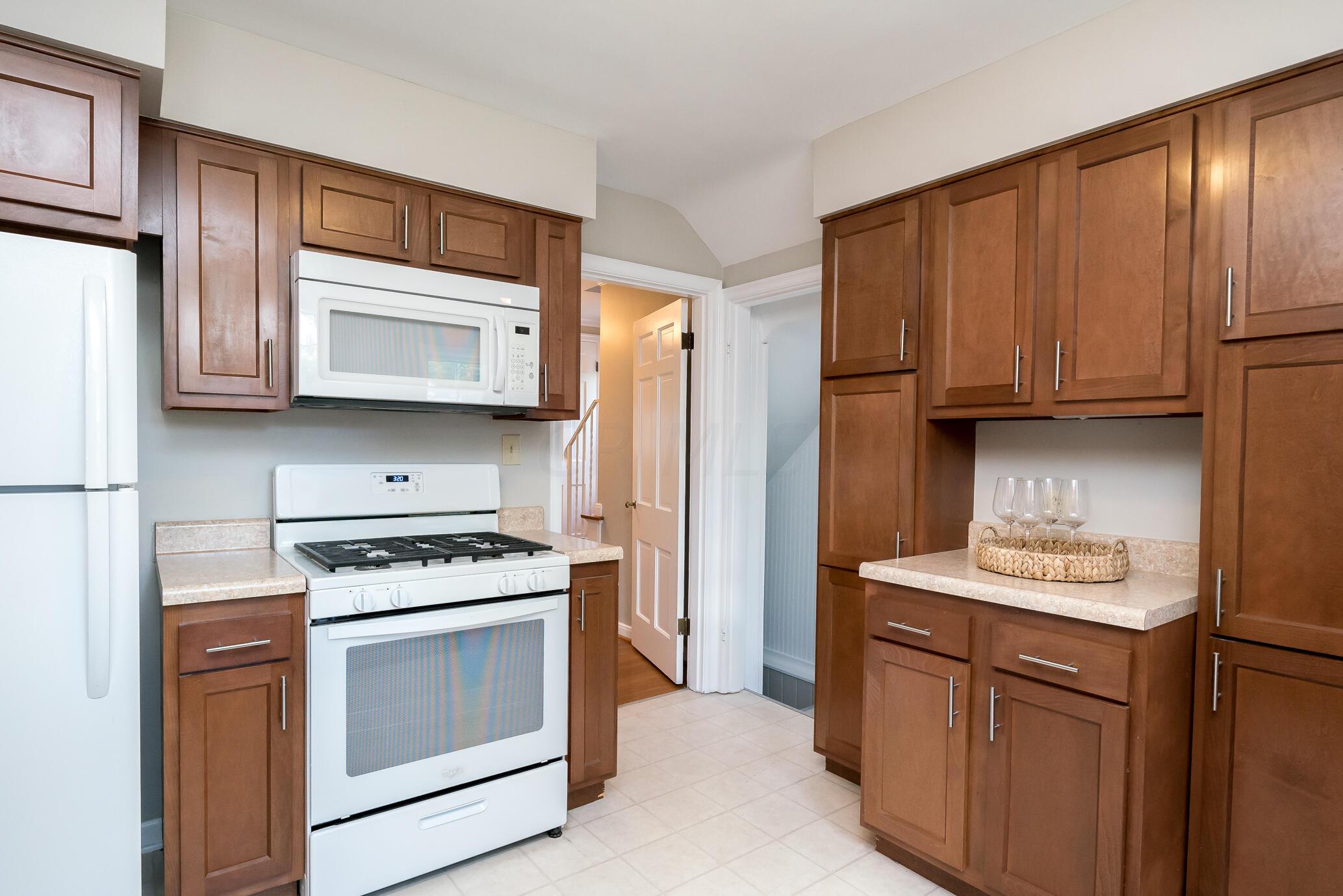 397 Arden Road Columbus, OH 43214 - Photo 12 of 44 Kitchen view `- all appliances remain, range, refrigerator, microwave, dishwasher.