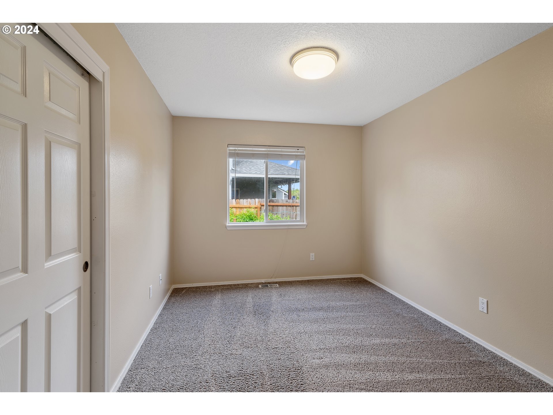 16716 Northeast 30th Court Ridgefield, WA 98642 - Photo 31 of 47 a view of an empty room with a window