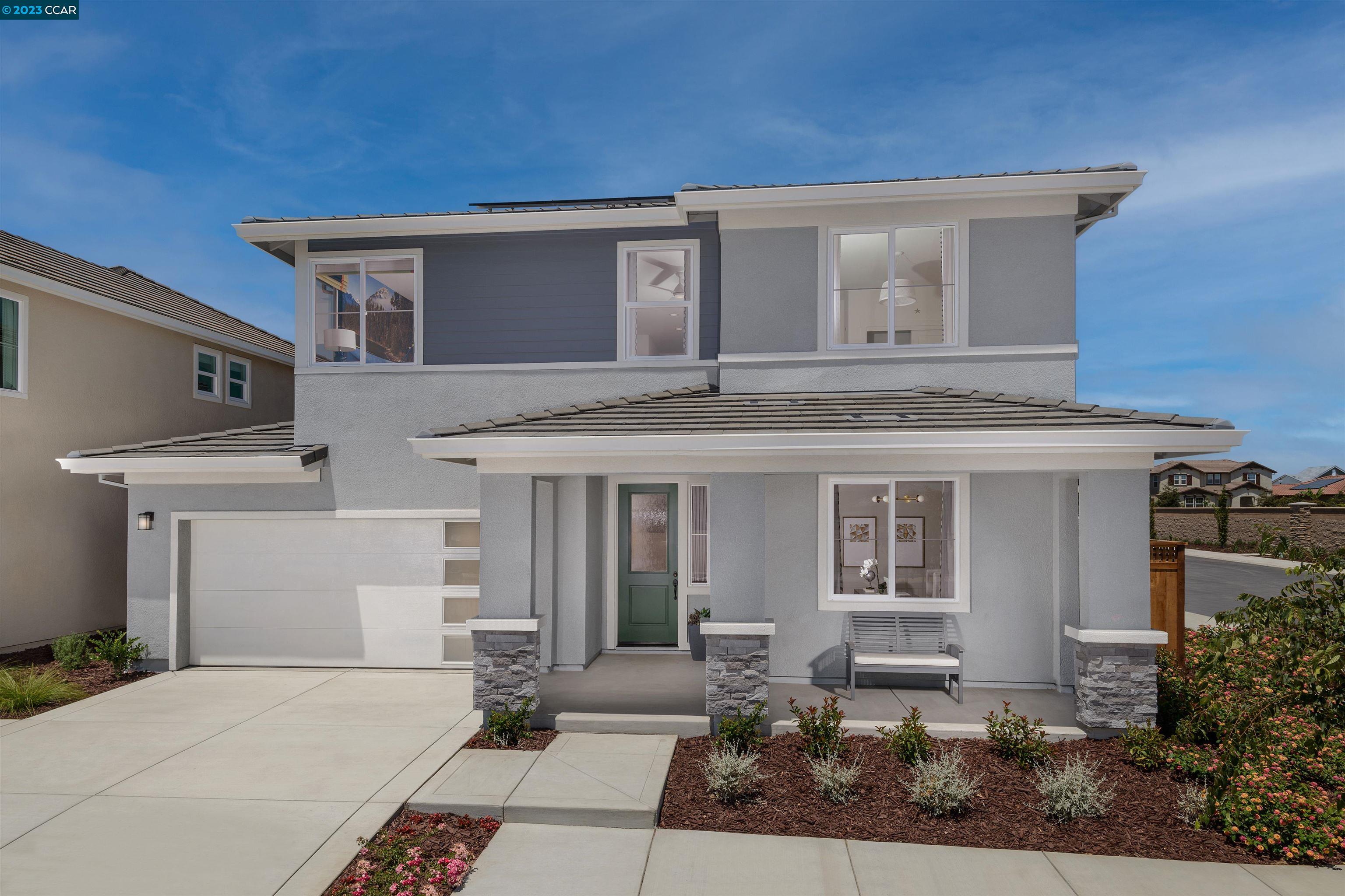 1917 Damson Street Manteca, CA 95337 - Photo 1 of 1 a front view of a house with a garden