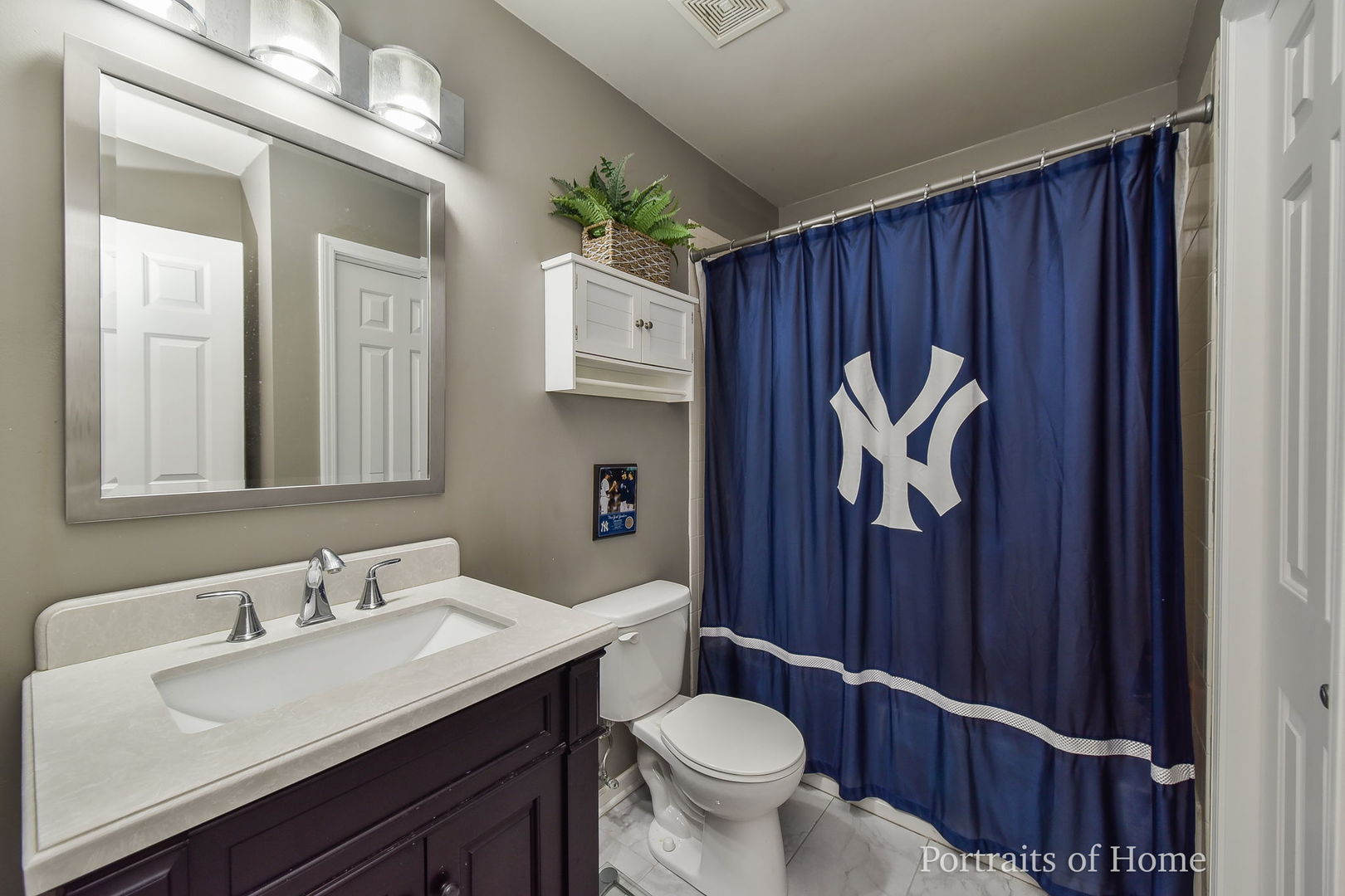 39W143 Bartelt Road Geneva, IL 60134 - Photo 15 of 21 a bathroom with a toilet a sink and mirror