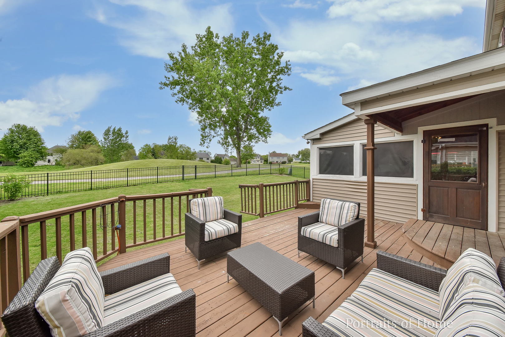 39W143 Bartelt Road Geneva, IL 60134 - Photo 19 of 21 a view of a patio with couches chairs and a floor to ceiling window