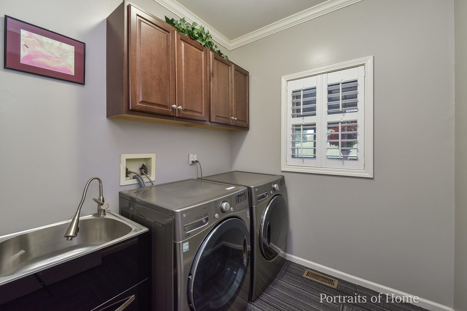 39W143 Bartelt Road Geneva, IL 60134 - Photo 8 of 21 a utility room with cabinets washer and dryer