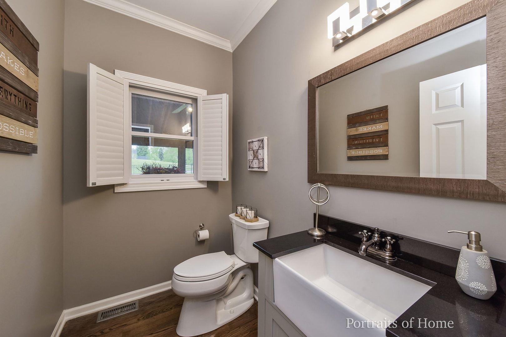 39W143 Bartelt Road Geneva, IL 60134 - Photo 9 of 21 a bathroom with a toilet a sink and mirror