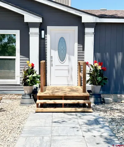 a house that has tree in front of it