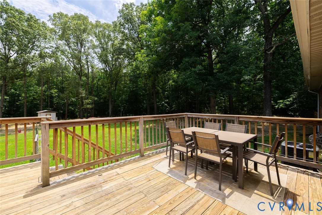 12397 New Market Mill Road Beaverdam, VA 23015 - Photo 32 of 44 a view of balcony with furniture and trees