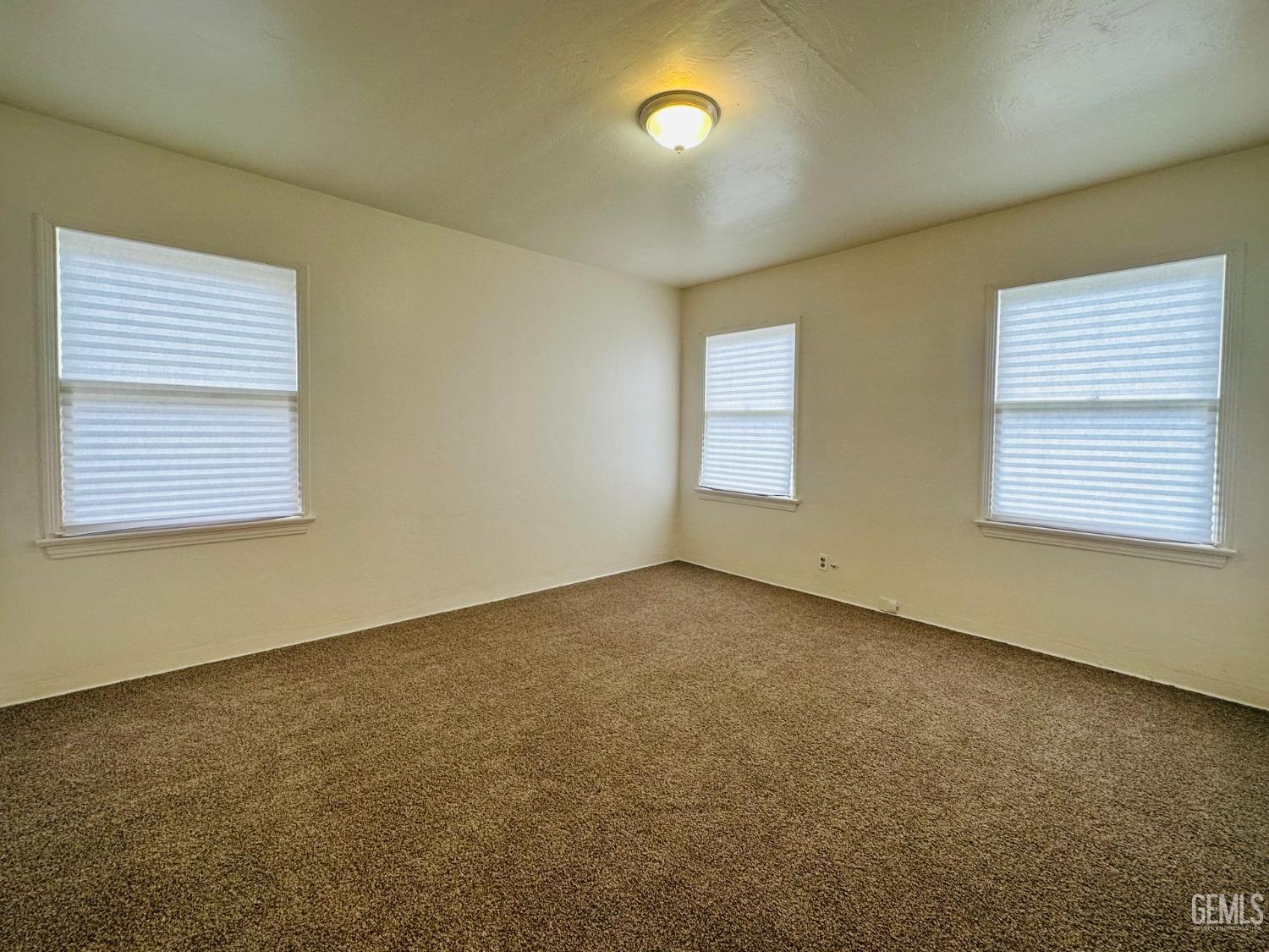 Undisclosed Address Bakersfield, CA 93308 - Photo 14 of 28 a view of an empty room with a window