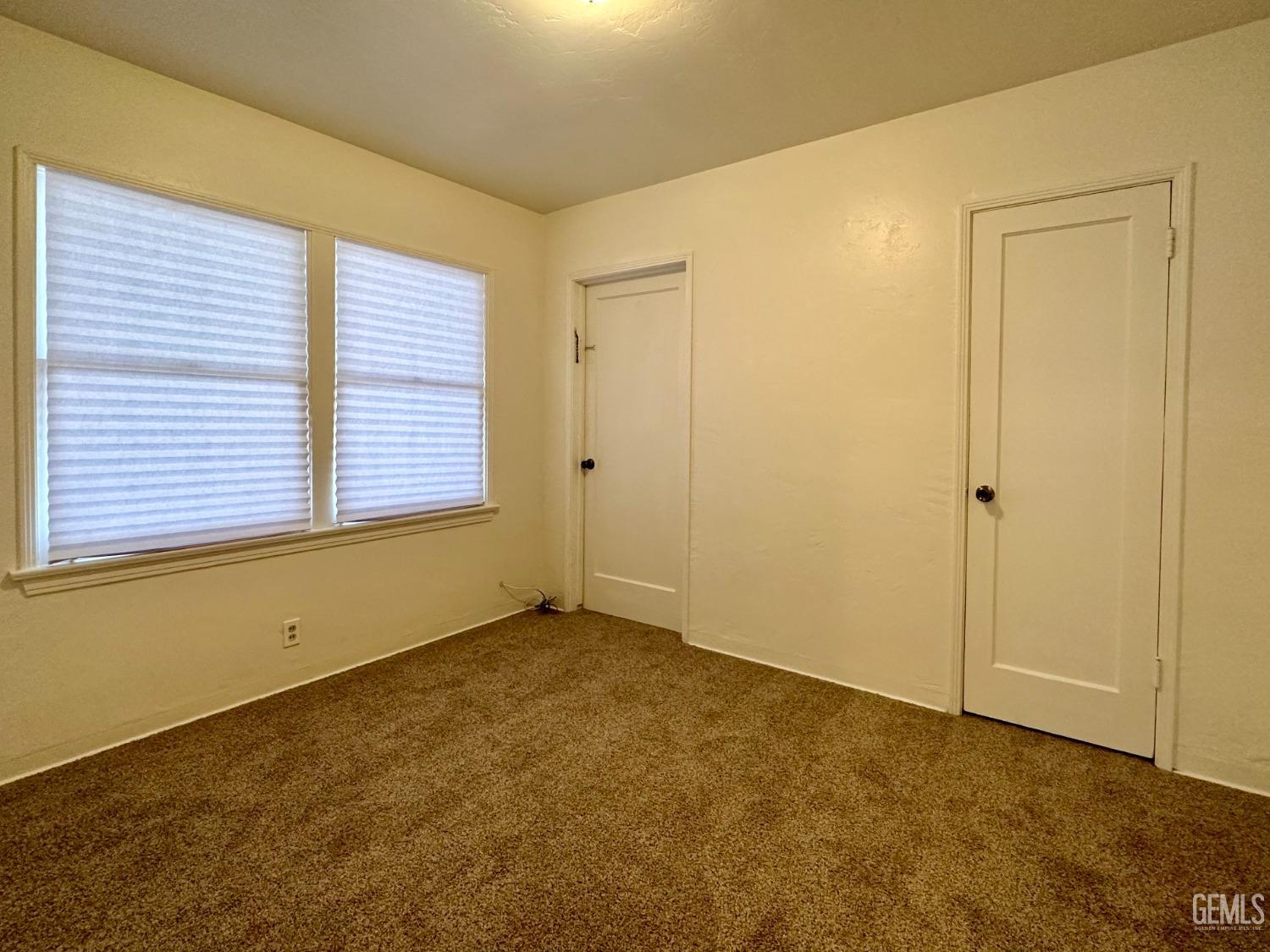 Undisclosed Address Bakersfield, CA 93308 - Photo 16 of 28 a view of an empty room with a window