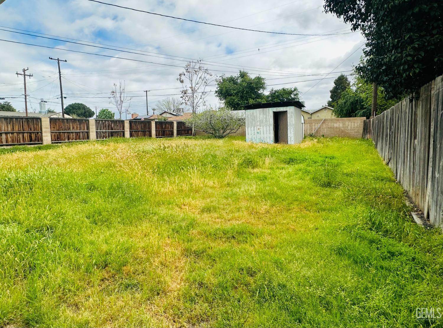 Undisclosed Address Bakersfield, CA 93308 - Photo 22 of 28 a front view of a house with a yard