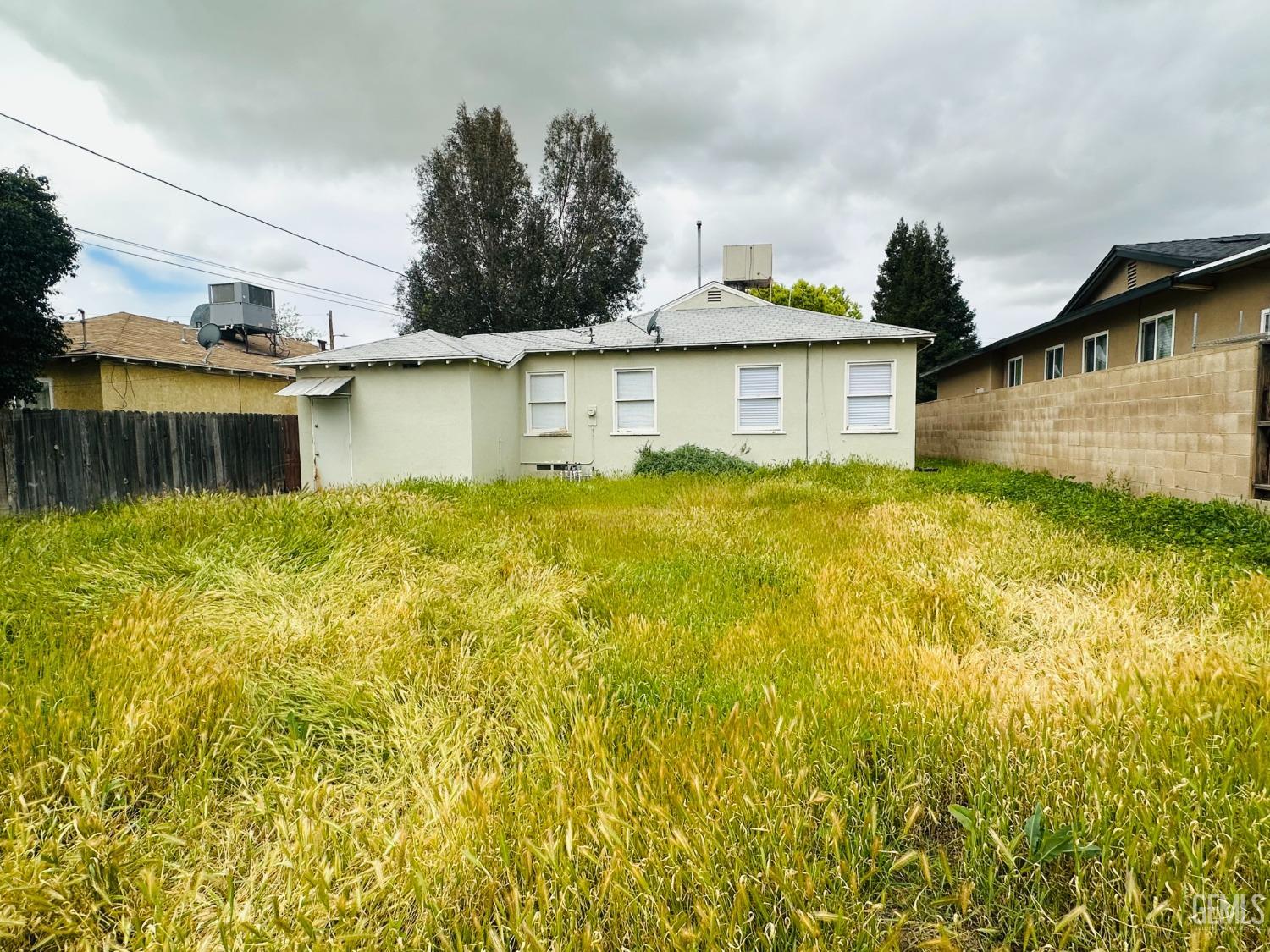 Undisclosed Address Bakersfield, CA 93308 - Photo 23 of 28 a view of a house with a yard