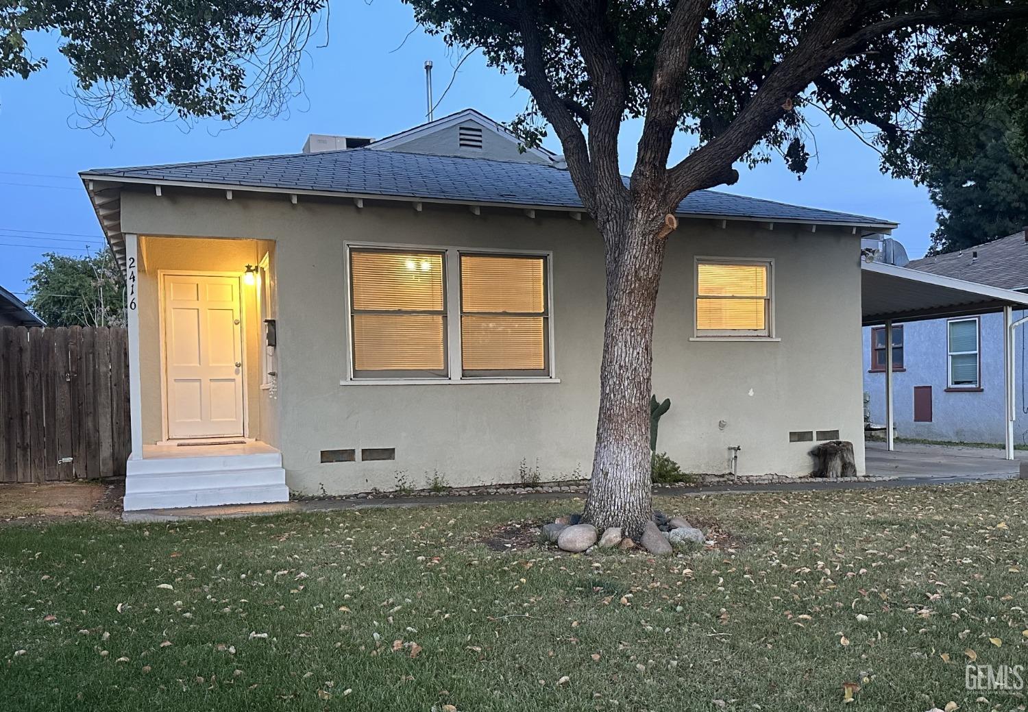 Undisclosed Address Bakersfield, CA 93308 - Photo 27 of 28 a front view of a house with garden