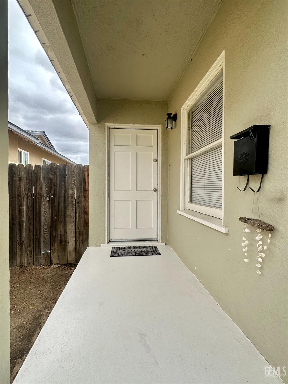 Undisclosed Address Bakersfield, CA 93308 - Photo 4 of 28 a view of an empty room with wooden floor