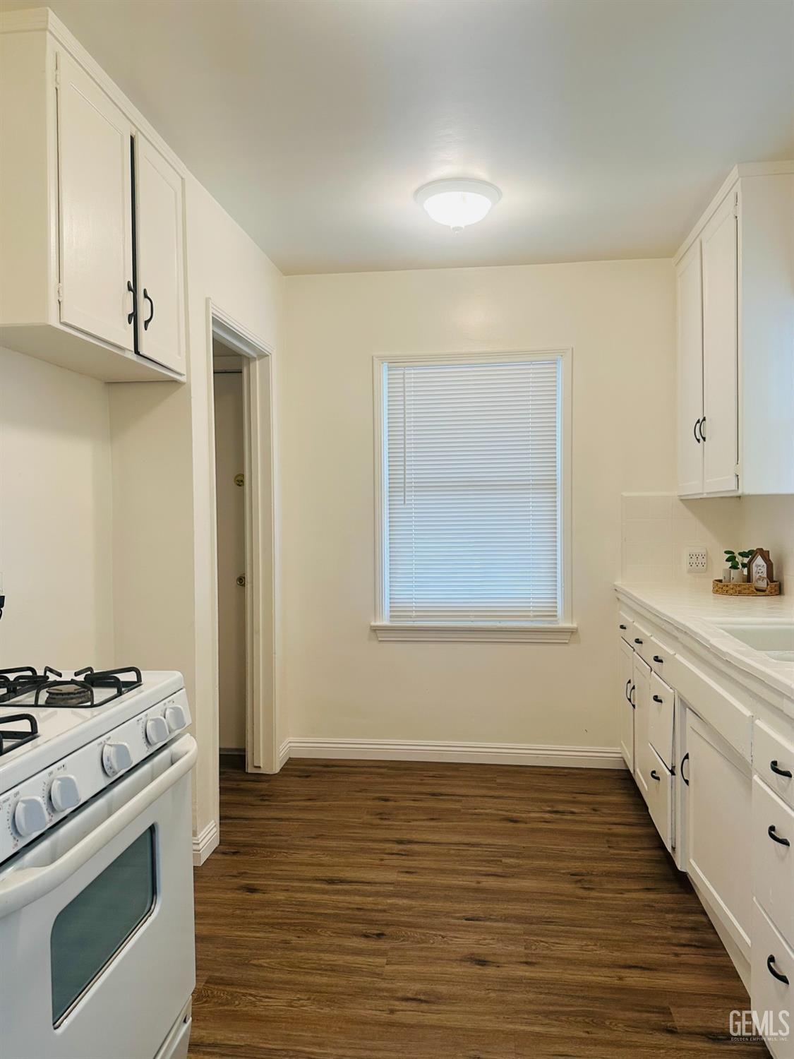 Undisclosed Address Bakersfield, CA 93308 - Photo 8 of 28 a kitchen with stainless steel appliances granite countertop a stove and a sink