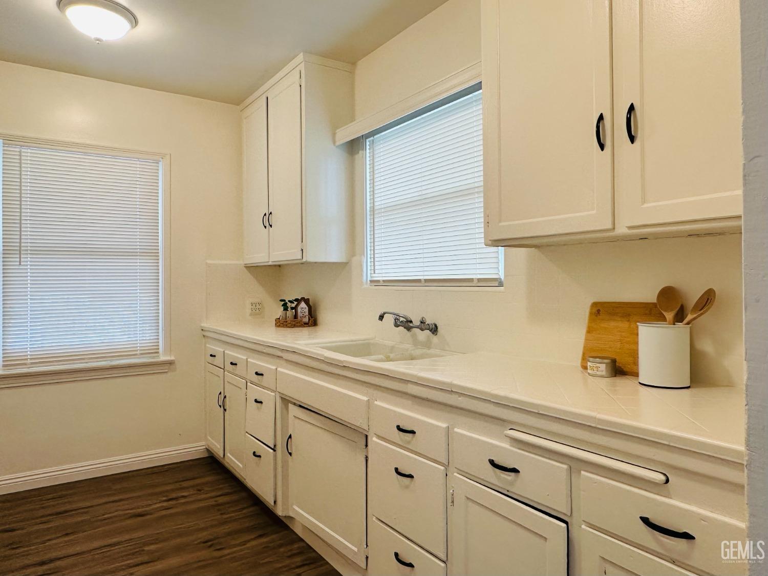 Undisclosed Address Bakersfield, CA 93308 - Photo 10 of 28 a kitchen with sink and cabinets