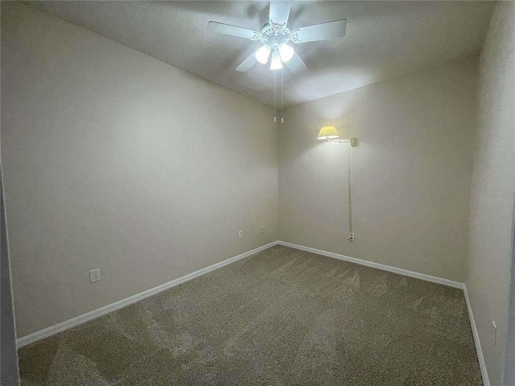 1228 Bensbrooke Drive Wesley Chapel, FL 33543 - Photo 18 of 37 an empty room with a fan & a window