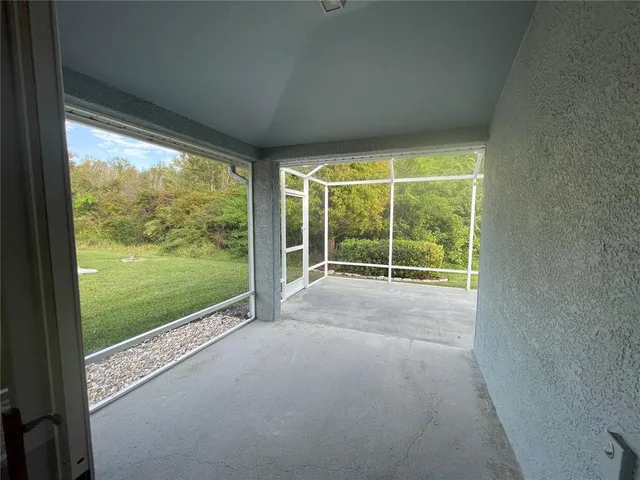 a view of a room next to a yard