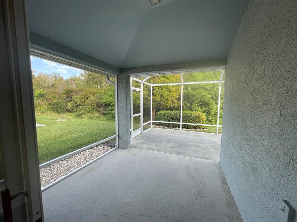 1228 Bensbrooke Drive Wesley Chapel, FL 33543 - Photo 21 of 37 a view of a room next to a yard
