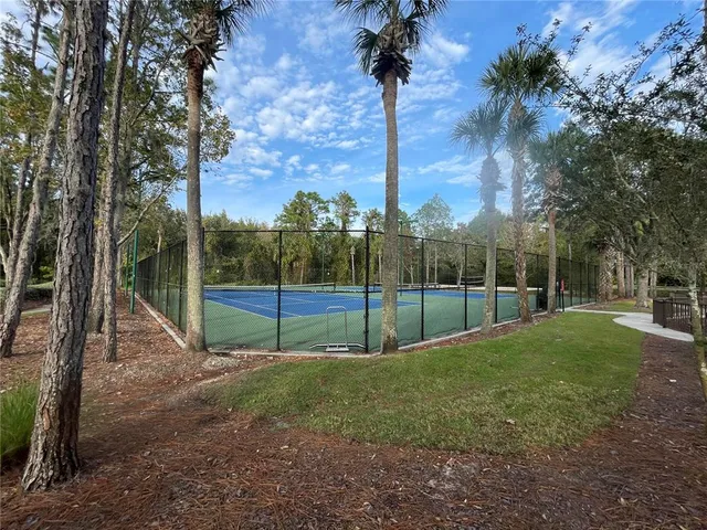 a view of outdoor space with playground and green space