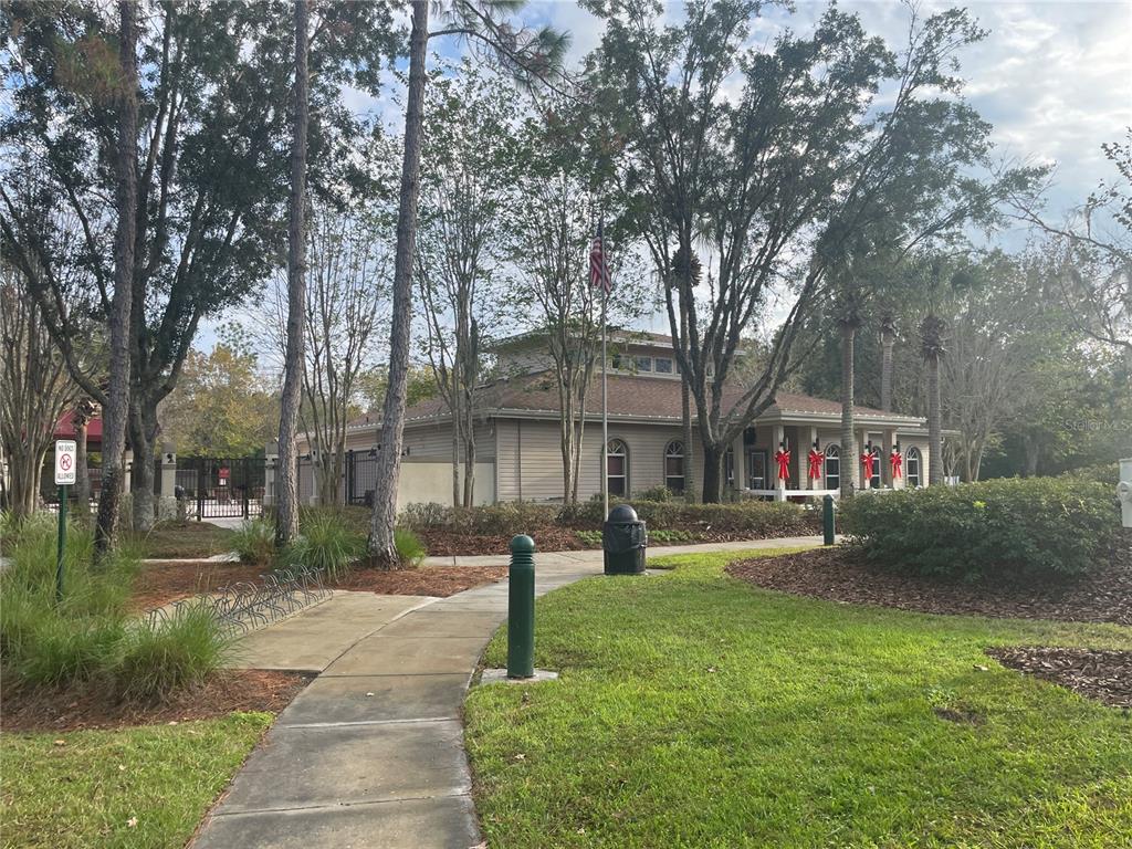 1228 Bensbrooke Drive Wesley Chapel, FL 33543 - Photo 37 of 37 a front view of a house with a yard and tree s