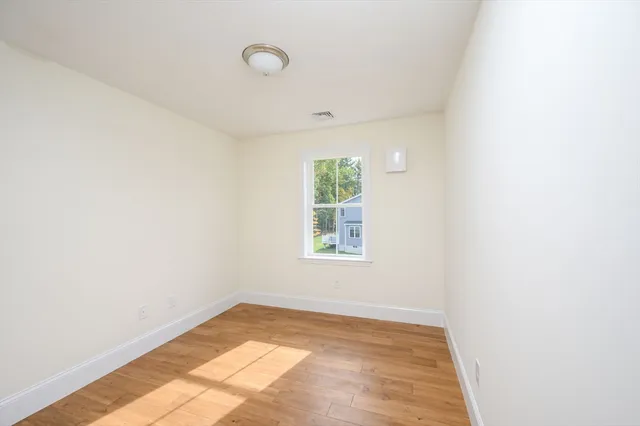 a view of a room with an empty walk in closet