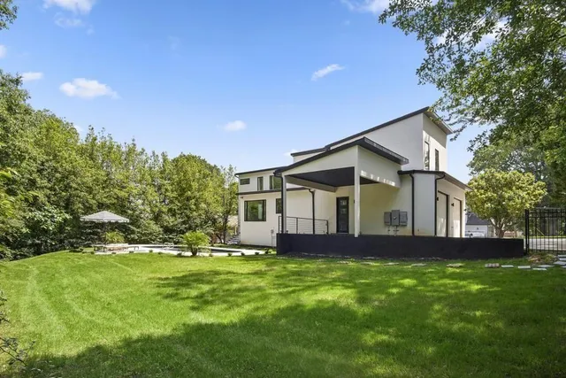 a living room with furniture wooden floor and a fireplace