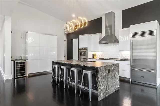 a bedroom with a bed and a couch with window