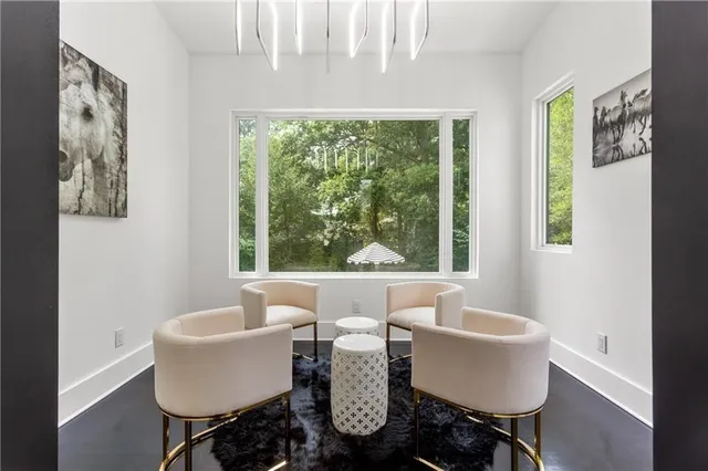 a room with a bed and a view of kitchen