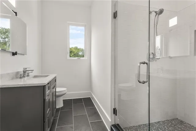 a view of a living room and dining room with wooden floor