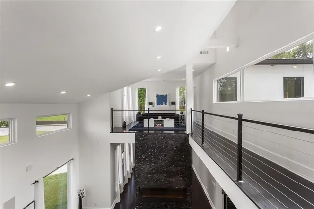 a living room with a bed furniture and a window