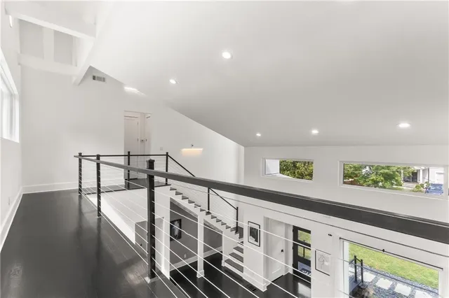 a bedroom with a bed and a night stand