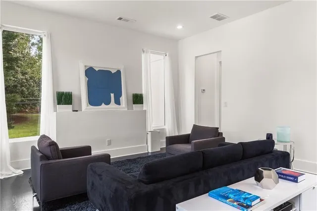 a view of a house with a backyard porch and sitting area